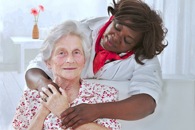 caregiver taking care of a senior woman